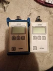 Lot Of 2 Afl Noyes OPM4-4C Sm Mm Fiber Optic Power Meters W/ 3 Adapter Caps Used. Price: $275.00.